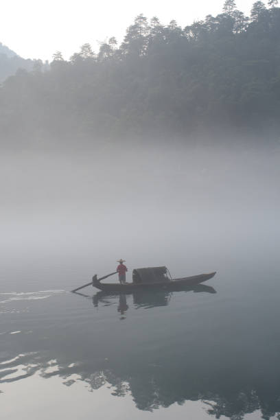 istock fishermen in the fog preparing to fish 155168992