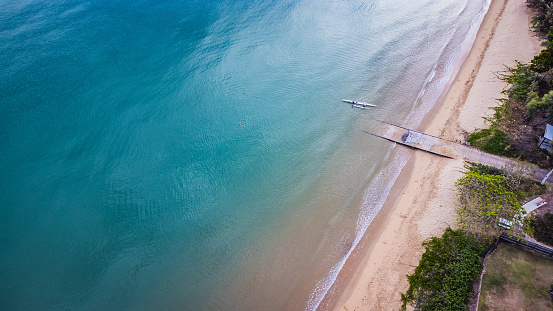 Aerial viewHervey Bay, Queensland, beachfront showing blue ocean glassed out ocean, flat blue ocean, beachfront jetty at Hervey Bay, Caravans on beachfront, RV on beachfront at Hervey Bay,