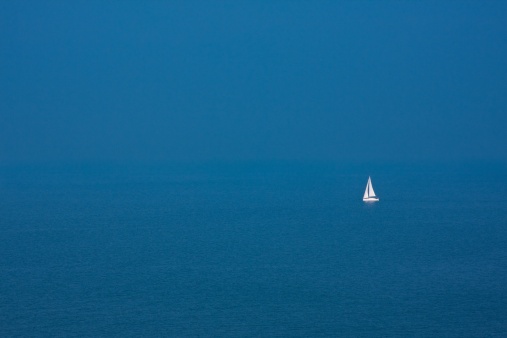 sailboat on the blue ocean