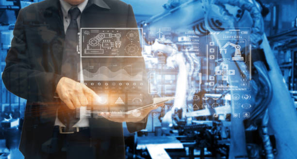 istock Digital future manufacture concept, Industrial Engineer working with automation robot arms machine  on real time monitoring system software. 1551708594