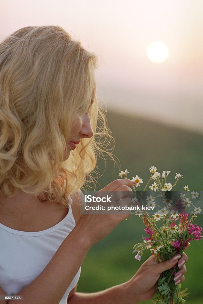 beautiful woman with bunch of wildflowers Activity Stock Photo