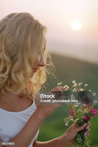Beautiful Woman With Bunch Of Wildflowers Stock Photo - Download Image Now - Activity, Adolescence, Adult