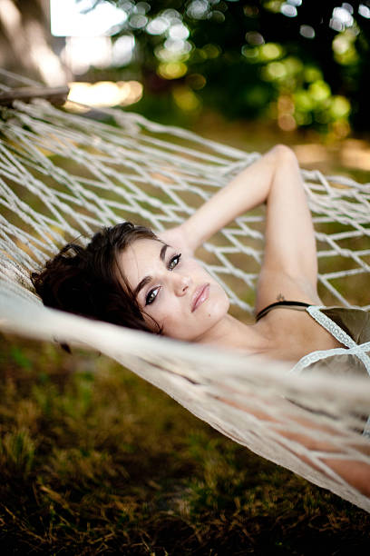 istock Gorgeous woman laying in a hammock 155172118