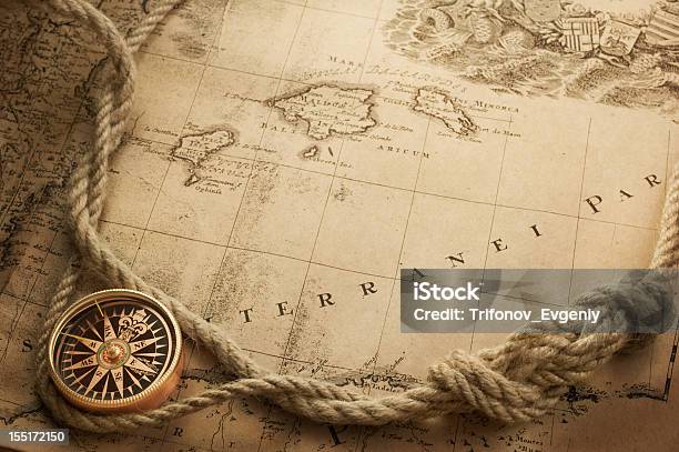 Vintage Style Image In Sepia Of An Old Map Rope And Compass Stock Photo - Download Image Now