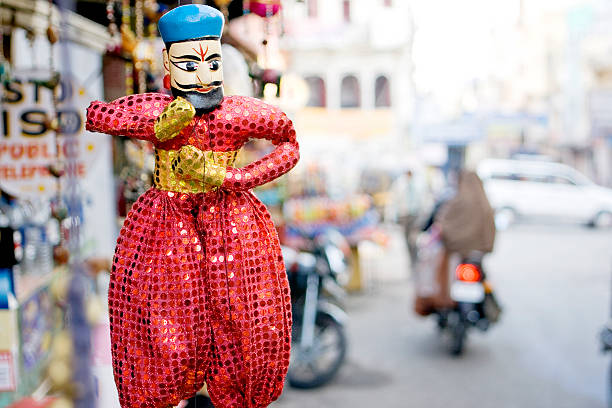 Indian puppet doll An indian puppet doll on display for sale by the street side in Udaipur, India. rajasthani puppets stock pictures, royalty-free photos & images