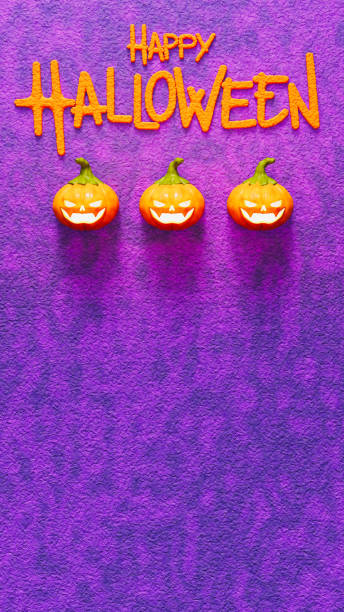 istock Three smiling pumpkins under Happy Halloween text on purple wall, celebration and horror theme 1551741697