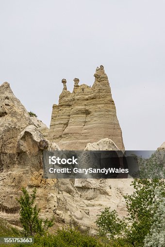 istock Look for the faces in the Rock formation called fairy chimneys in Love Valley, Goreme, Cappadocia, Turkey. 1551753663
