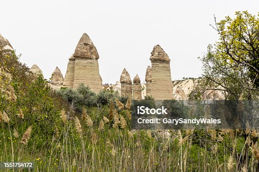 istock Rock formation called fairy chimneys in Love Valley, Goreme, Cappadocia, Turkey. 1551754172