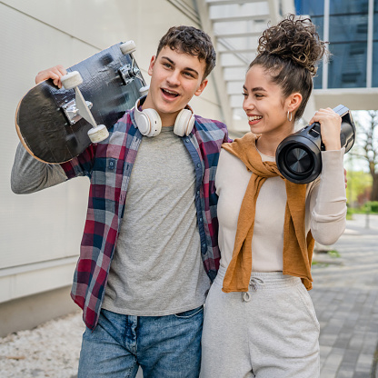 modern brother and sister or couple young man and woman walk outdoor