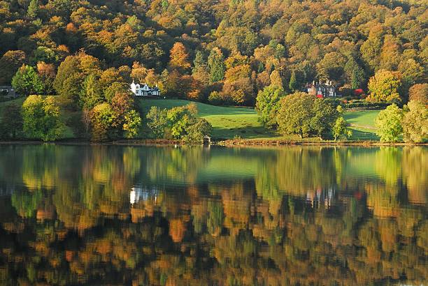 English Lake District autumn colours and reflections. English Lake District autumn colours and reflections. View of a calm Grasmere lake. grasmere stock pictures, royalty-free photos & images