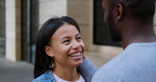 istock Happy mixed race couple together outdoors in city. 1551855819
