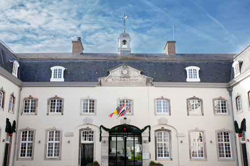 Picture of the town hall of Vaals with Dutch, belgian and german flags on the Vaals city hall in the netherlands. It's part of Meuse Rhine Euroregion. The MeuseRhine Euroregion, Euregio MaasRijn, Eurorégion MeuseRhin, Euregio MaasRhein is a Euroregion created in 1976, with judicial status achieved in 1991. It comprises 11.000 km2 and has around 3.9 million inhabitants around the city-corridor of AachenMaastrichtHasseltLiège. The seat of the region has been in Eupen, Belgium since 1 January 2007. Within a wider context, the region is part of what is called the Blue Banana European urbanisation corridor.
