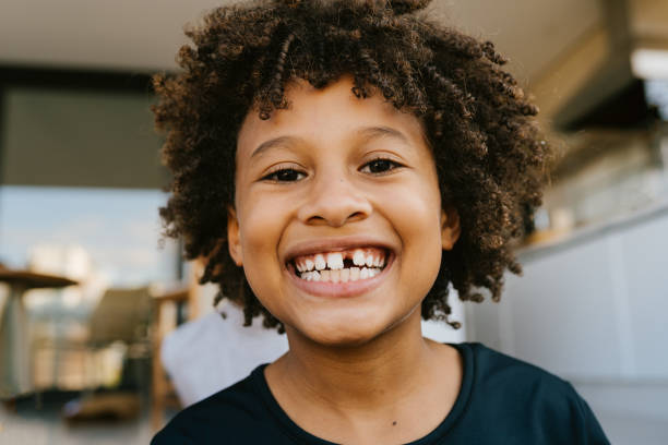 istock Portrait of a toothless boy smiling 1551948057