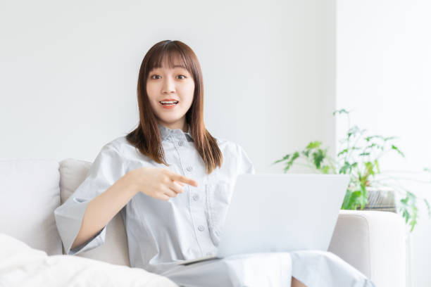 istock young asian woman using laptop 1552001847
