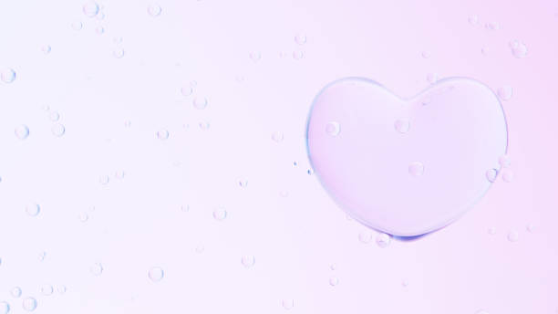 istock 3D Illustration.Transparent heart and multiple bubbles on pink background. (Horizontal) 1552035554