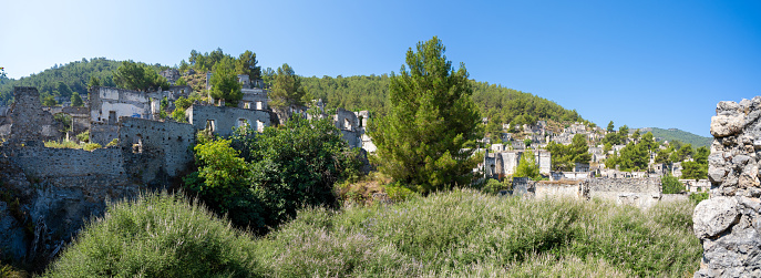 Panoramic view of ancient Greek house ruins in the ghost town of Kayakoy. Kayakoy is abandoned Greek village in Fethiye district, Turkey.