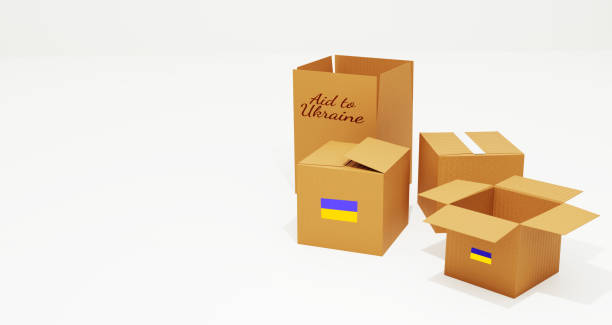 istock Aid to Ukraine Concept background with cardboard boxes and flag printed on them along with free space 1552036872