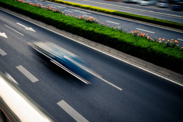 istock car driving on city road, high angle view, beijing china 1552039924