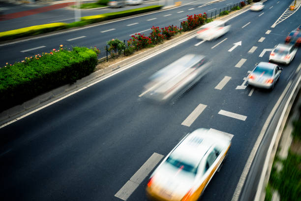 istock car driving on city road, high angle view, beijing china 1552040491