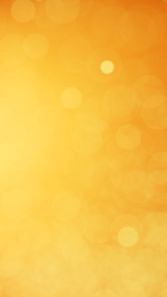 istock 3D Illustration.Light on orange background. Blurred light. Ball blur. (Vertical) 1552042099