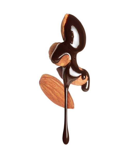 istock Almonds covered with melted chocolate close-up isolated on a white background 1552045935