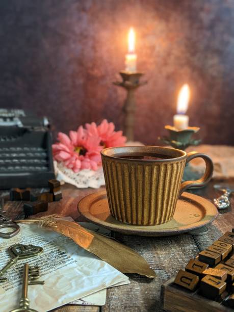 istock dark photography with candle, flower and book. 1552176786
