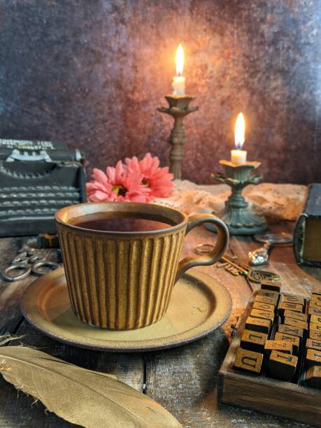 istock dark photography with candle, flower and book. 1552178842