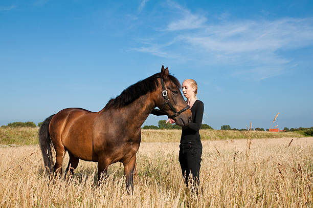 istock women with horse 155218311