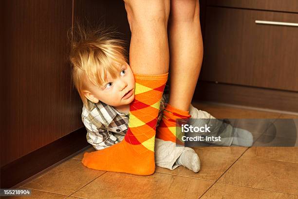 Boy Hiding Behind Mother Stock Photo - Download Image Now - Mother, Sock, Son
