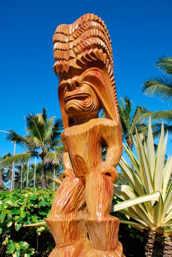 Carved wooden statue of Tiki or Hawaiian God of humanoid form.