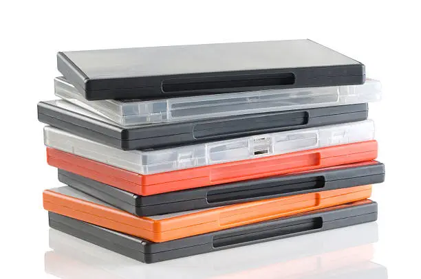 Photo of Stacked DVD cases on a white background