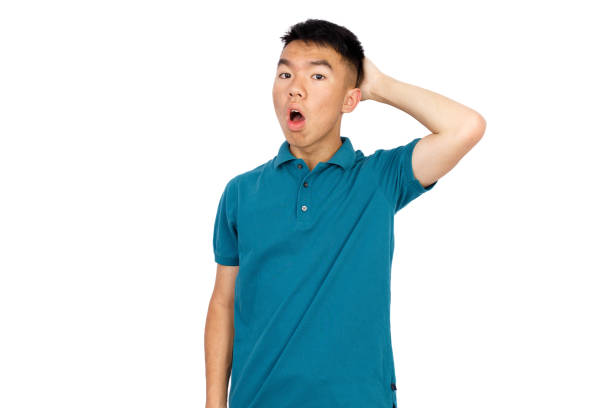 istock Surprised teenage boy scratching his head thinking 1552257586