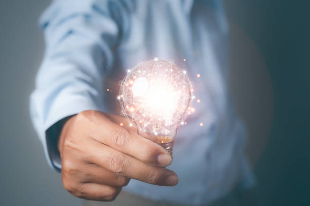 istock Man holding light bulbs the new ideas with innovation technology and creative. 1552262779