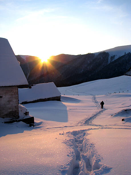 Winter evening in the mountainous village. stock photo