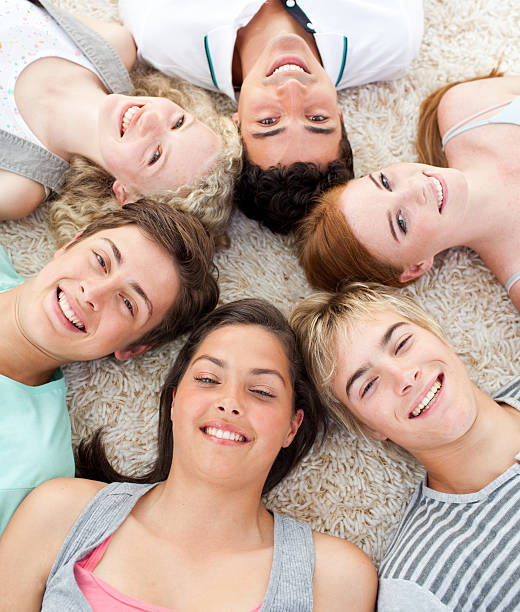 istock Teenagers with their heads together smiling 155227055