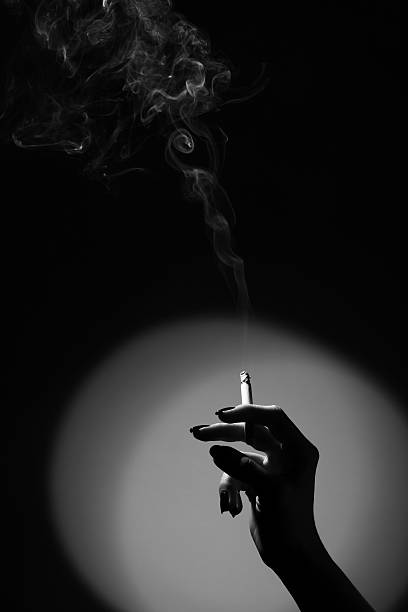hand with a cigarette stock photo