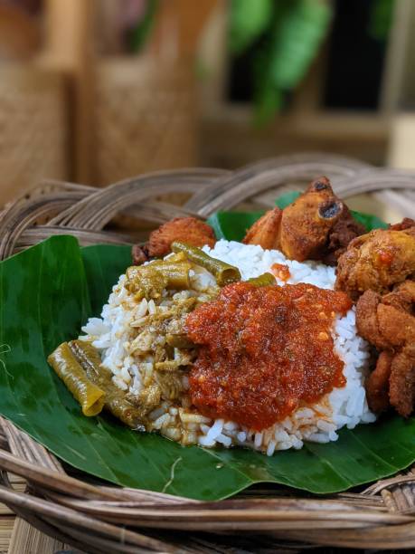 istock Nasi Kukus is usually comprising freshly steamed rice, crispy fried chicken, sambal belacan, acar and a curry gravy 1552274848
