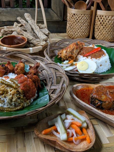 istock Nasi Kukus is usually comprising freshly steamed rice, crispy fried chicken, sambal belacan, acar and a curry gravy 1552283250