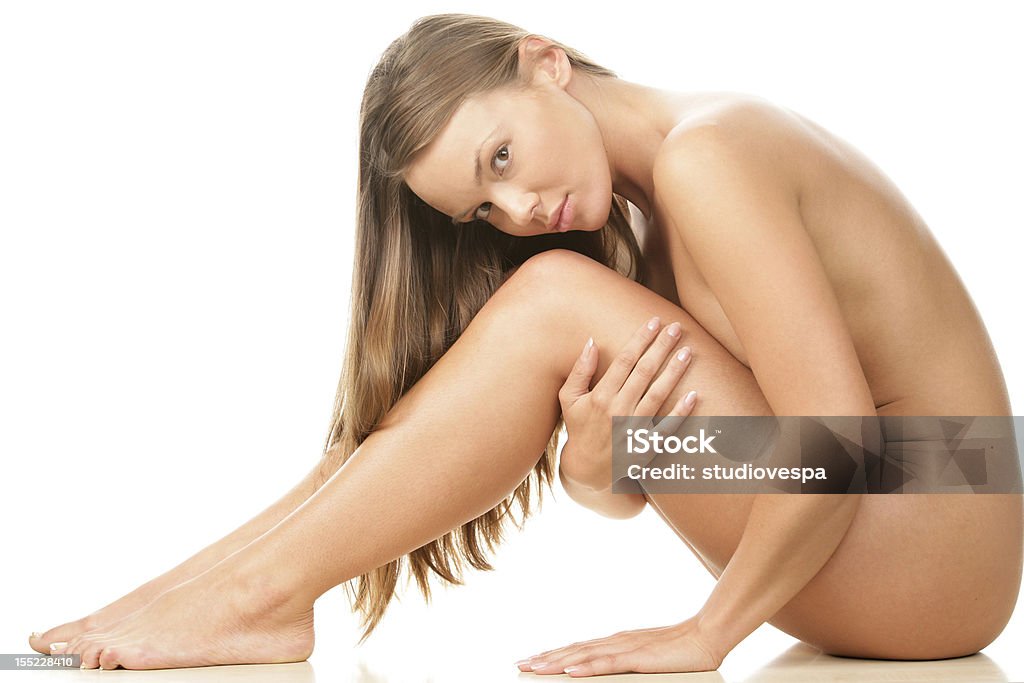Young beautiful naked woman sitting Naked Stock Photo
