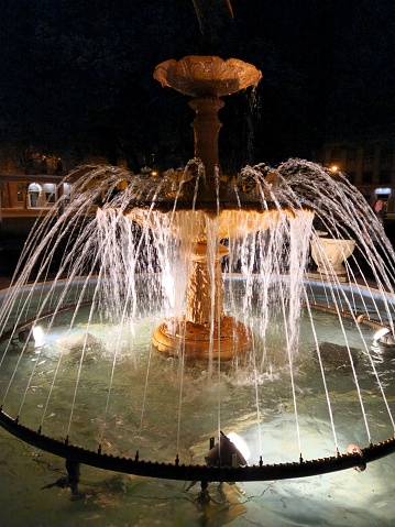 City fountain with blue neon lights.