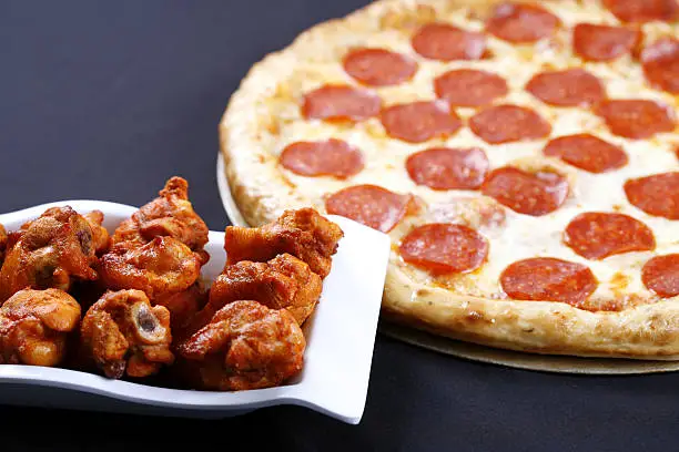 Photo of pizza and wings combo