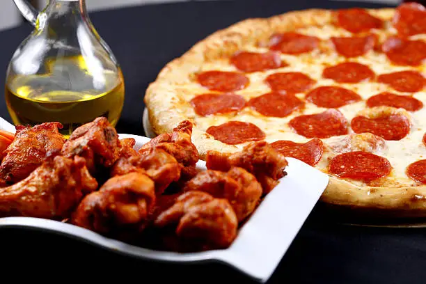 Photo of pizza and wings combo