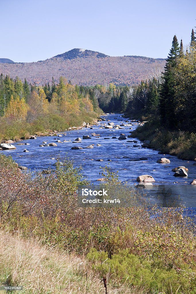 New Hampshire river Very blue river in White Mountains of New Hampshire snaking toward mountain in background.  Clear blue sky. Appalachia Stock Photo