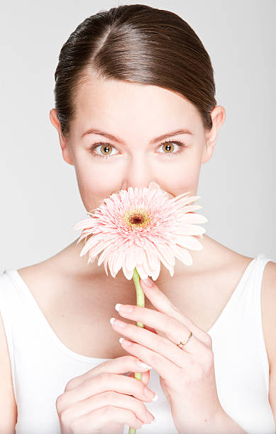 istock girl with flower 155232590