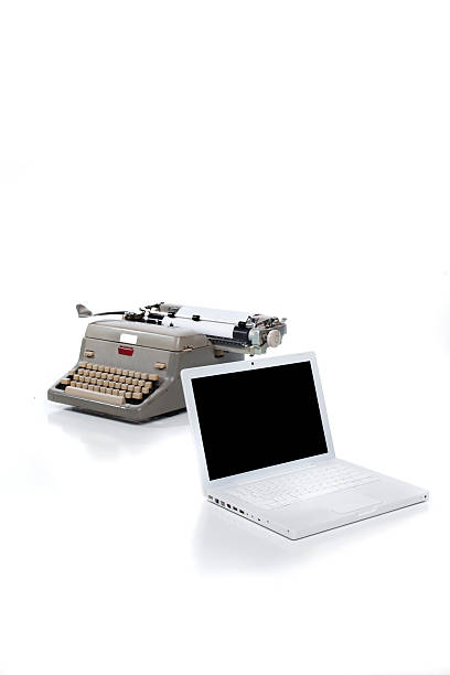 Typewriter and Laptop stock photo