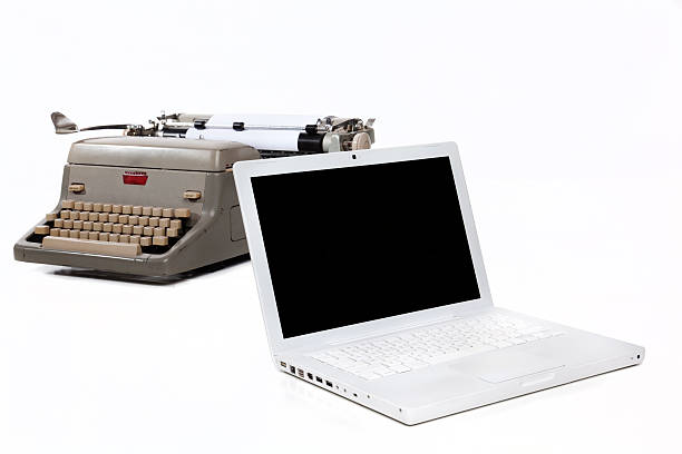 Typewriter and Laptop stock photo