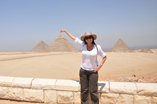 Woman touching pyramids