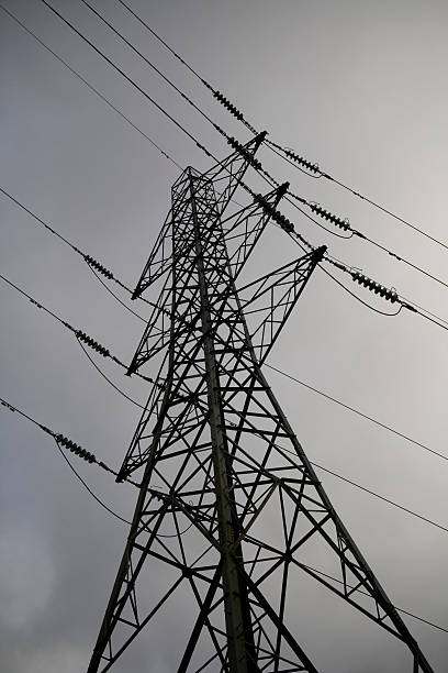 Electricity Pylon clouds and sky stock photo