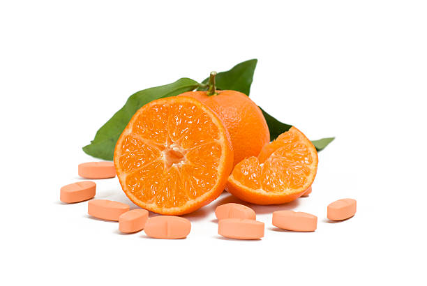 istock Mandarine with leaf and vitamin capsules 155235922