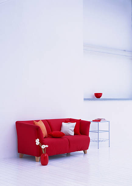 istock Red Sofa Under Pillow on Wooden Floor 155236262